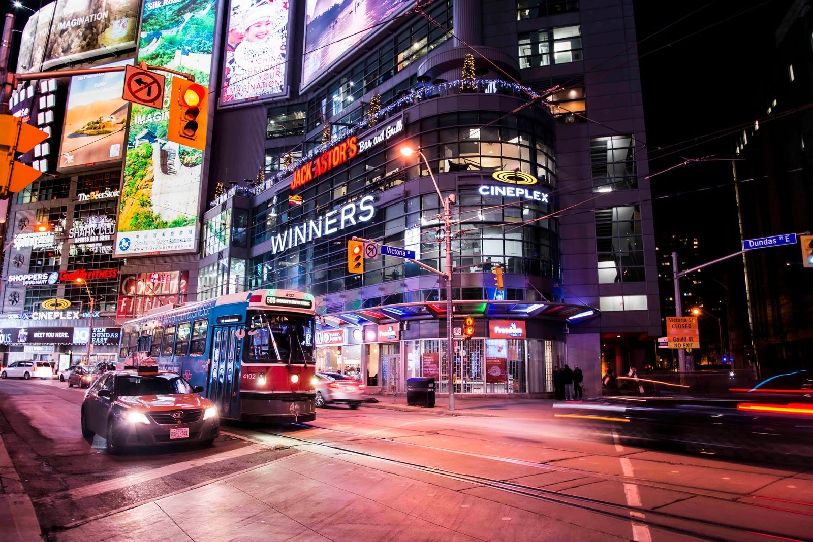 Toronto street with a streetcar at night